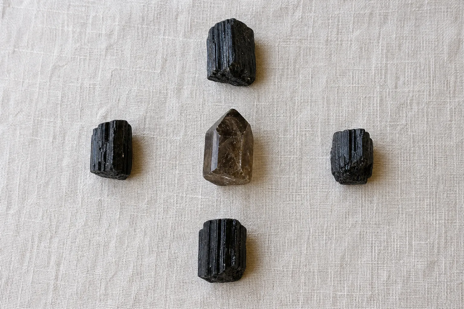 A compact Earth Anchor grid with smoky quartz at the center and black tourmaline at four directional points